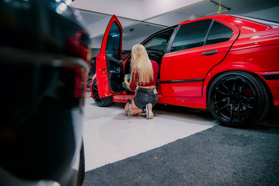 Professional cleaning the interior dashboard of a car