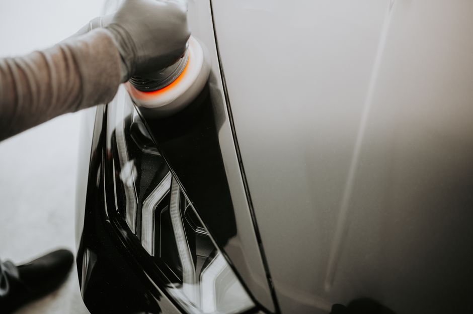 Applying premium wax to car paint for protection